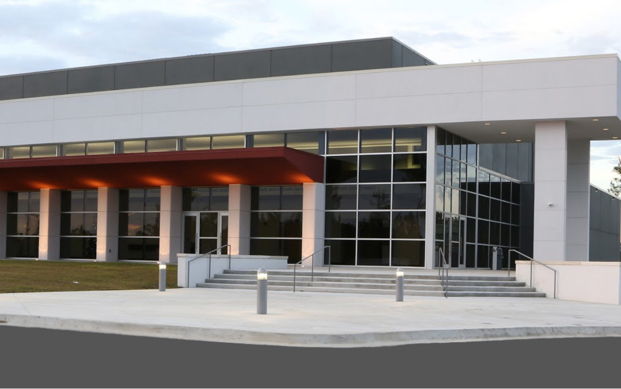 Performing Arts Center during the day walls of windows with 5 steps to the front door